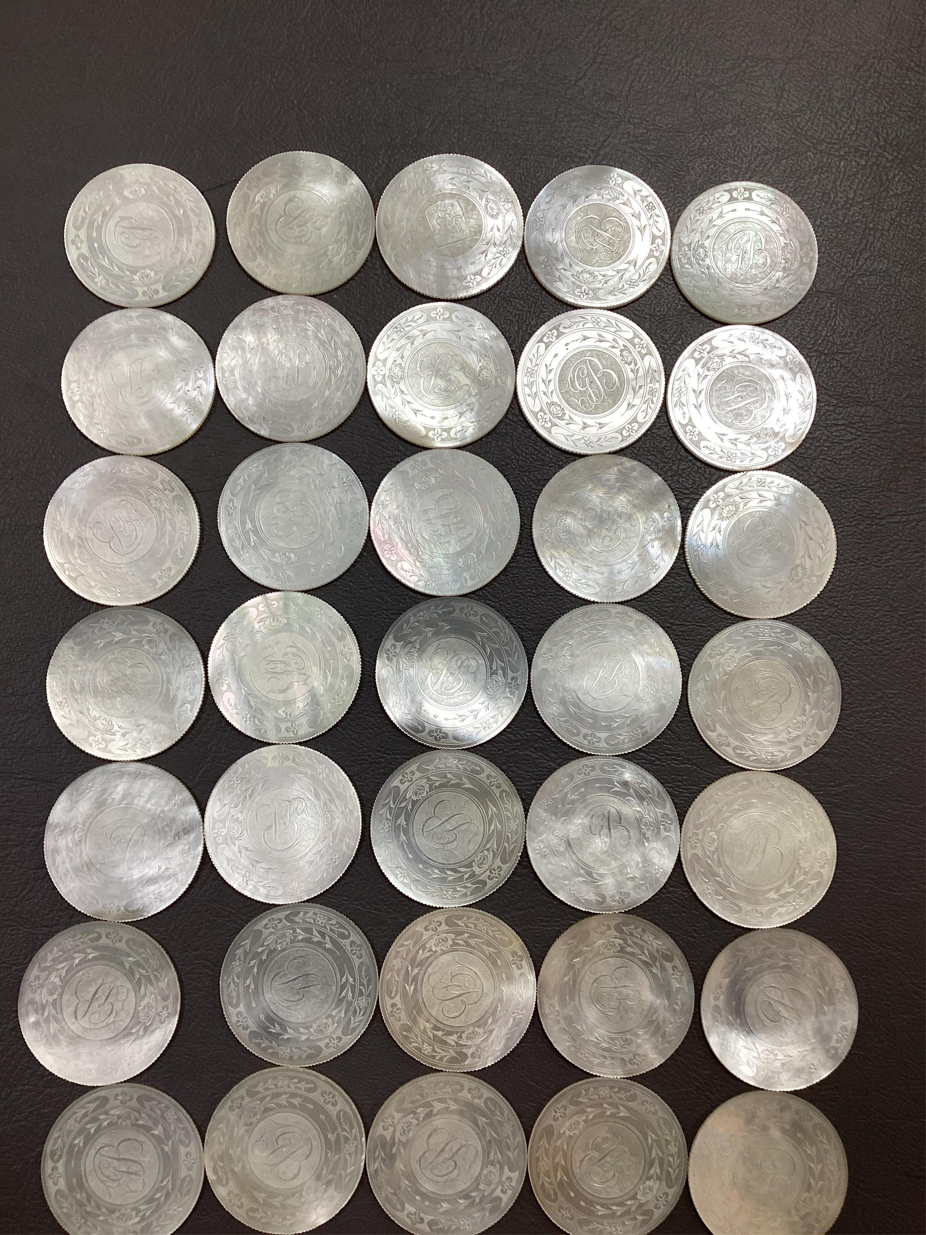 Two Chinese gilt decorated black lacquer games boxes, containing numerous mother-of-pearl counters, 19th century